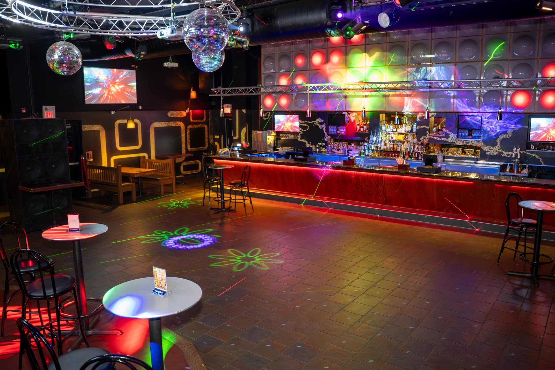 Cactus Jaxx nightclub floor facing the illuminated bar and disco balls