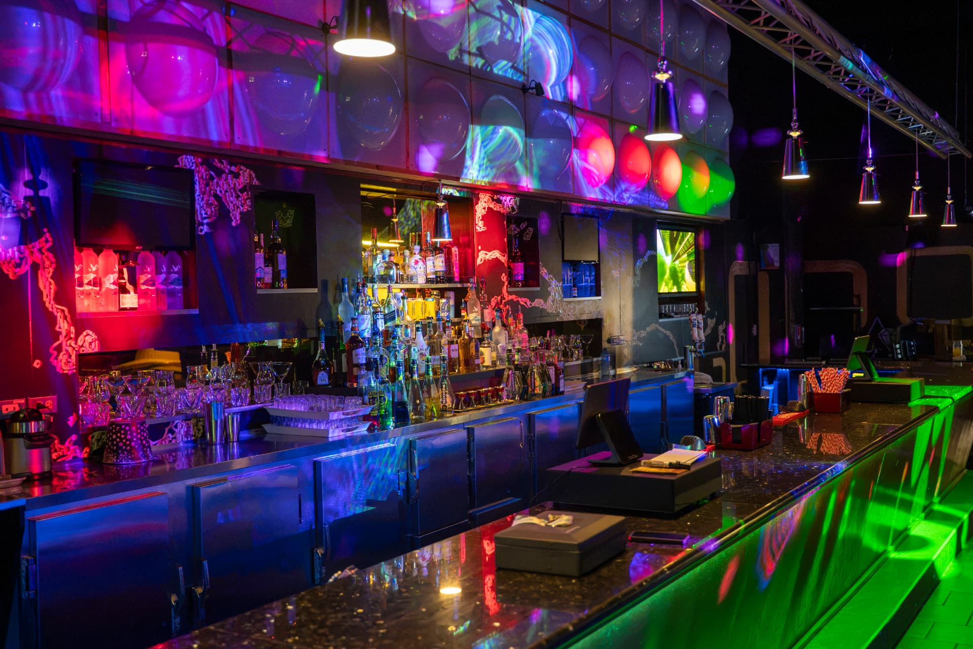 Cactus Jaxx bar illuminated with colourful projected lights