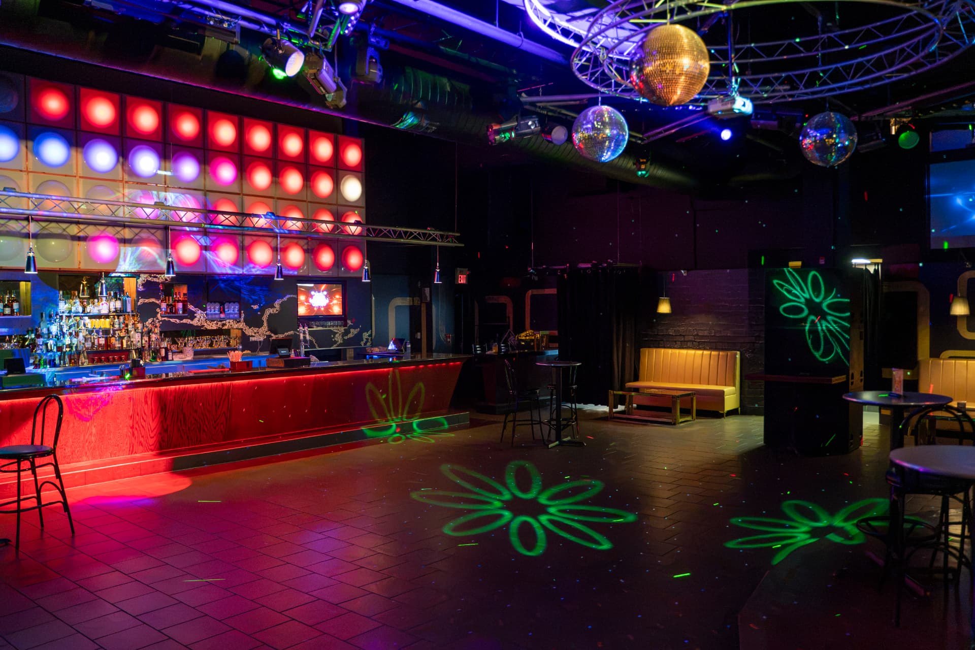 Cactus Jaxx dance floor, bar and disco balls under nightclub lighting