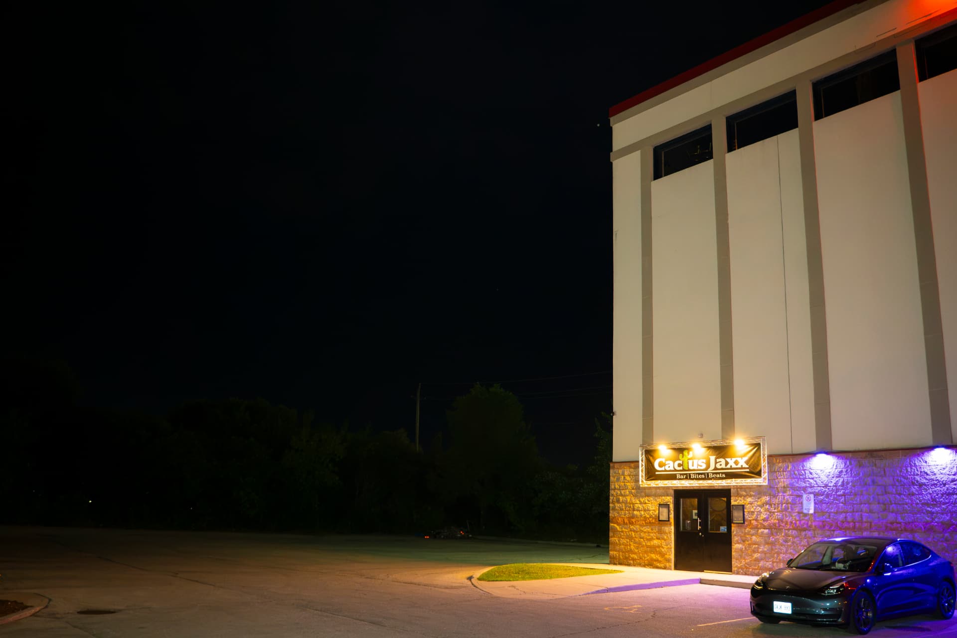 Cactus Jaxx Cambridge exterior and illuminated entrance at night