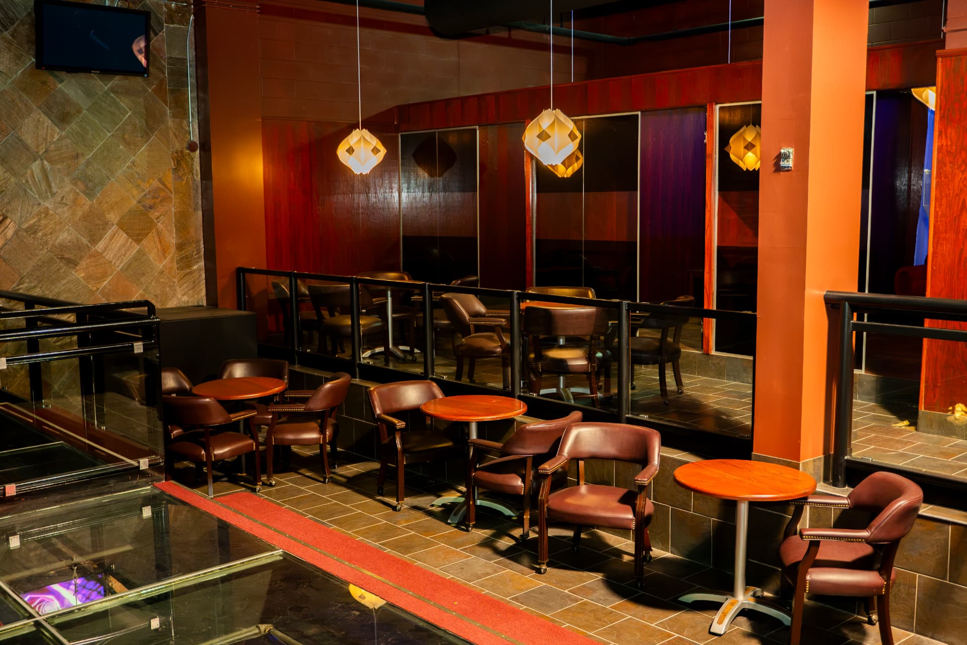 Elevated lounge seating with warm pendant lights at Cactus Jaxx Cambridge