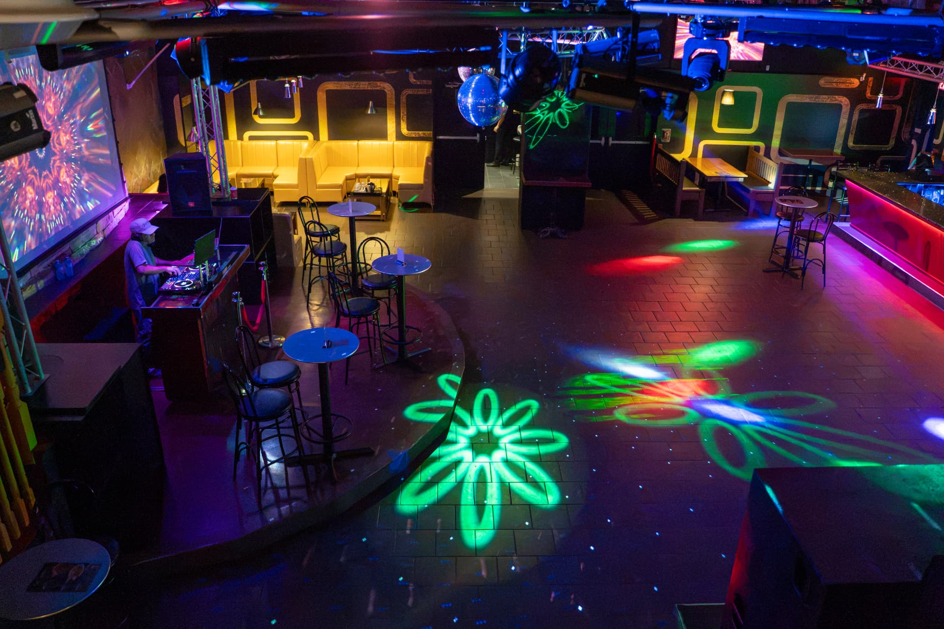 Elevated view over the Cactus Jaxx DJ booth and colourful dance floor
