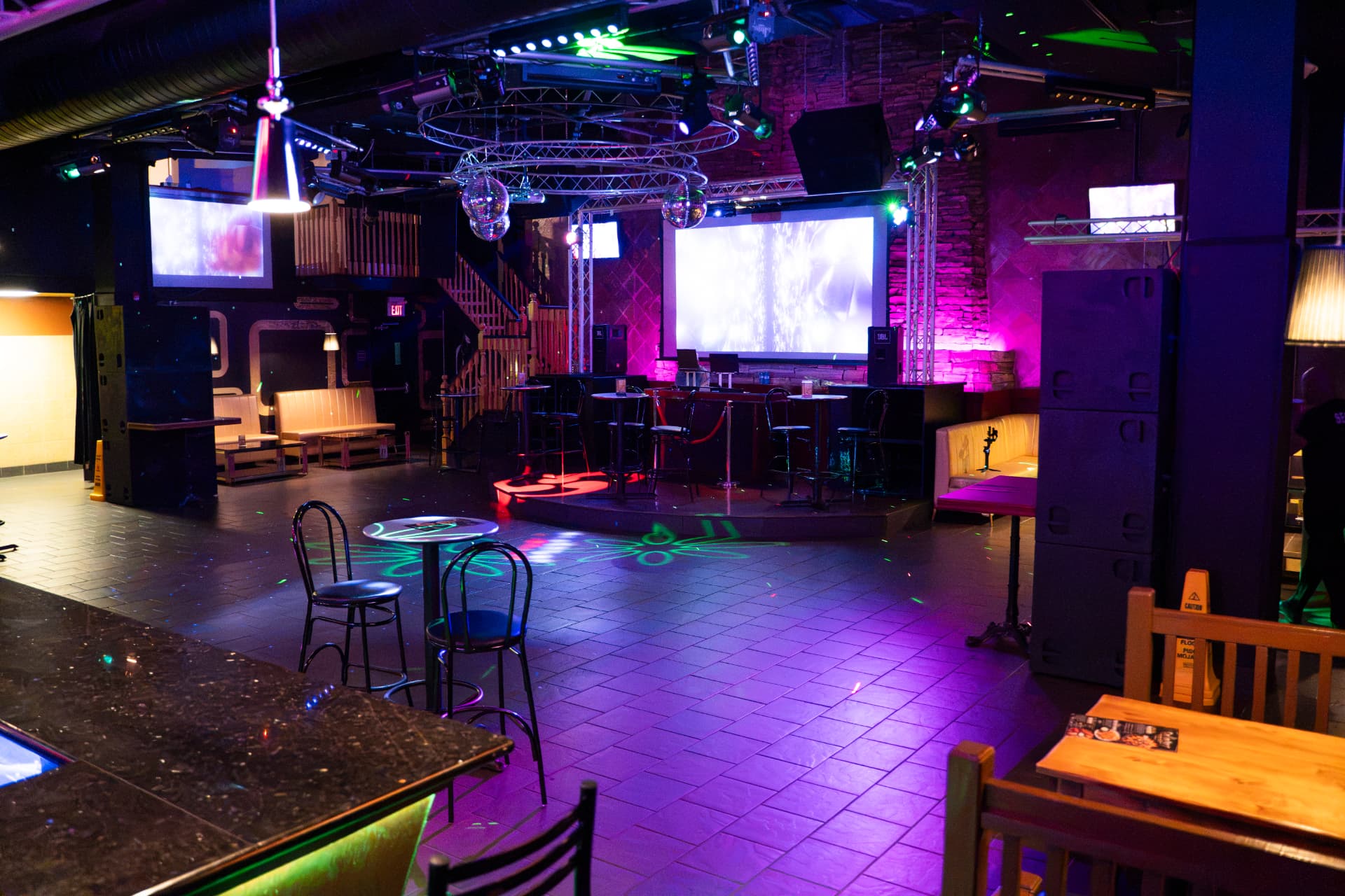 Cactus Jaxx main floor with stage screens, lighting and lounge seating